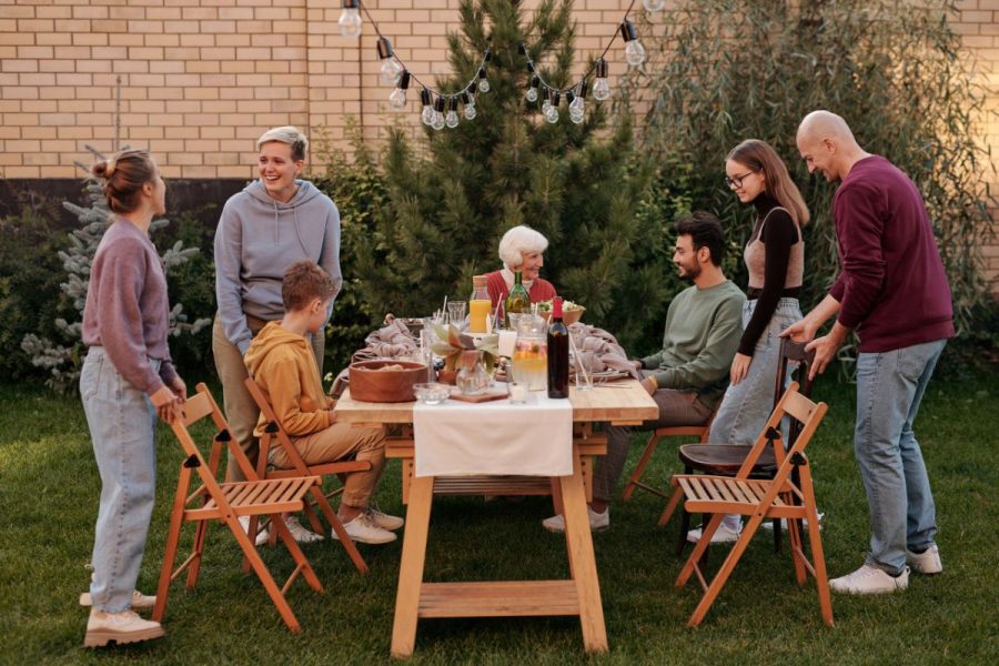 Family sitting outside at a dinner table